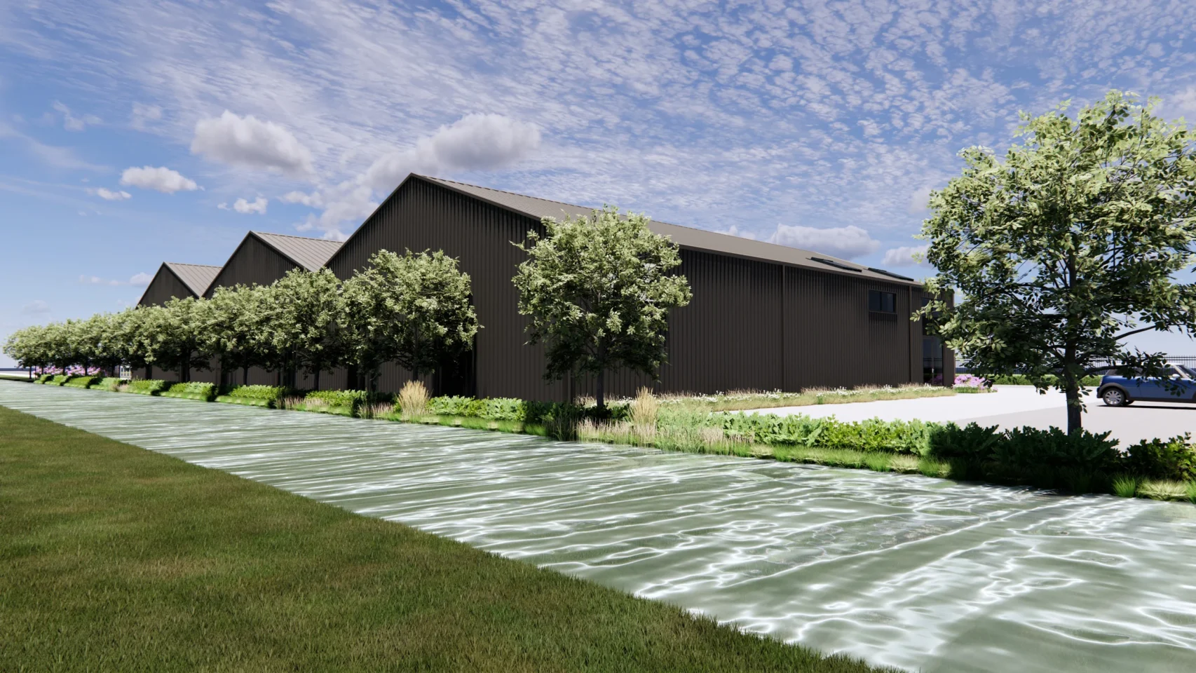 3D-impressie van de achterzijde van de stadshub van I&L Logistiek met donkere gevelbekleding, schuine daklijnen en groene terreininrichting.